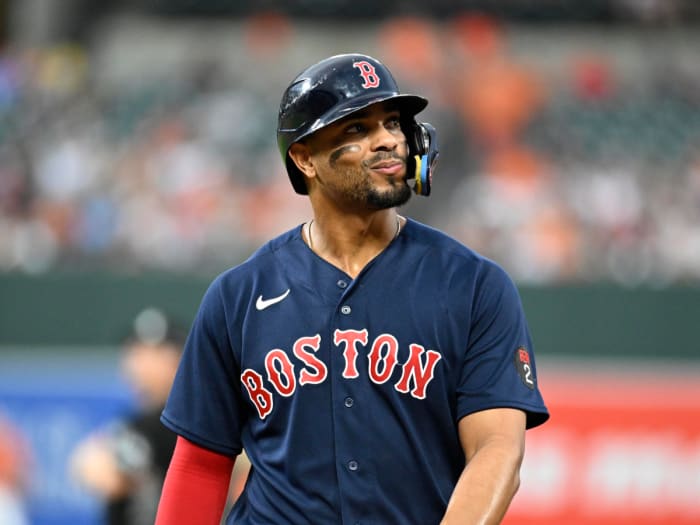 Red Sox shortstop Xander Bogaerts looks out to the crowd as he walks back to the dugout.